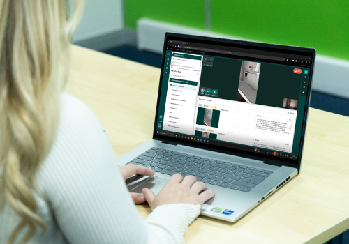 CoAssess on laptop with Retrofit Coordinator working from office